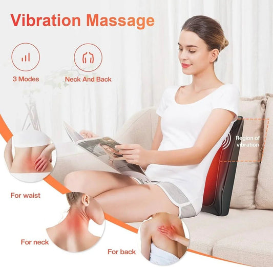 Woman using SP!NECK™ ergonomic back and neck vibration massage device on a sofa