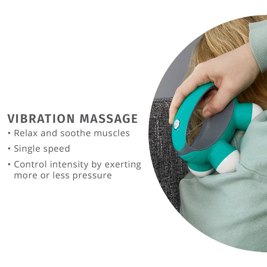 Hand holding SP!NECK™ ergonomic vibration massage tool on shoulder for muscle relaxation