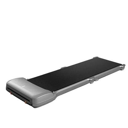 Compact under-desk walking treadmill with black belt and silver frame for home fitness